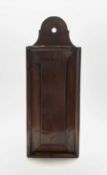 Early 19th century mahogany candle box with a shaped top and panelled sliding cover