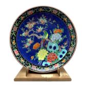 Late 19th/early 20th Century Japanese charger decorated with bird and flowering trees on a blue grou