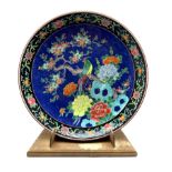 Late 19th/early 20th Century Japanese charger decorated with bird and flowering trees on a blue grou