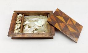 19th century parquetry book shape box containing approx eighty five Chinese mother of pearl gaming c
