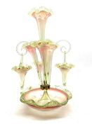 Victorian pink and green glass epergne with four trumpet shape vases and three suspended baskets wit