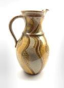 William Illsley (b1948) - Stamford pottery jug decorated in yellow and green on a speckled ground an