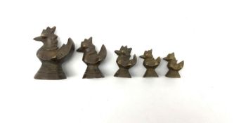 Set of five Burmese bronze graduated opium weights in the form of ducks Largest H4cm
