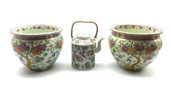 Pair of 20th Century Chinese jardinieres decorated with flowering shrubs and with seal mark to base