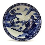 Late 19th Century Japanese charger decorated with a landscape in blue and white D49cm