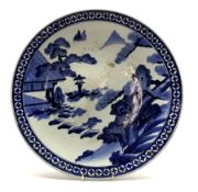 Late 19th Century Japanese charger decorated with a landscape in blue and white D49cm