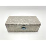 Arts and Crafts design pewter rectangular box decorated with a raised pattern of leaves and inset wi