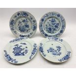 Two 18th century Delft tin-glazed plates with similar floral design and brown rims