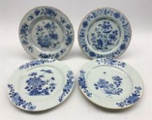 Two 18th century Delft tin-glazed plates with similar floral design and brown rims