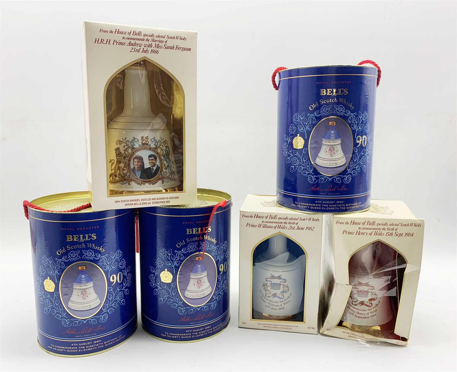 Three Wade Bell's whisky royal commemorative decanters in cylindrical boxes