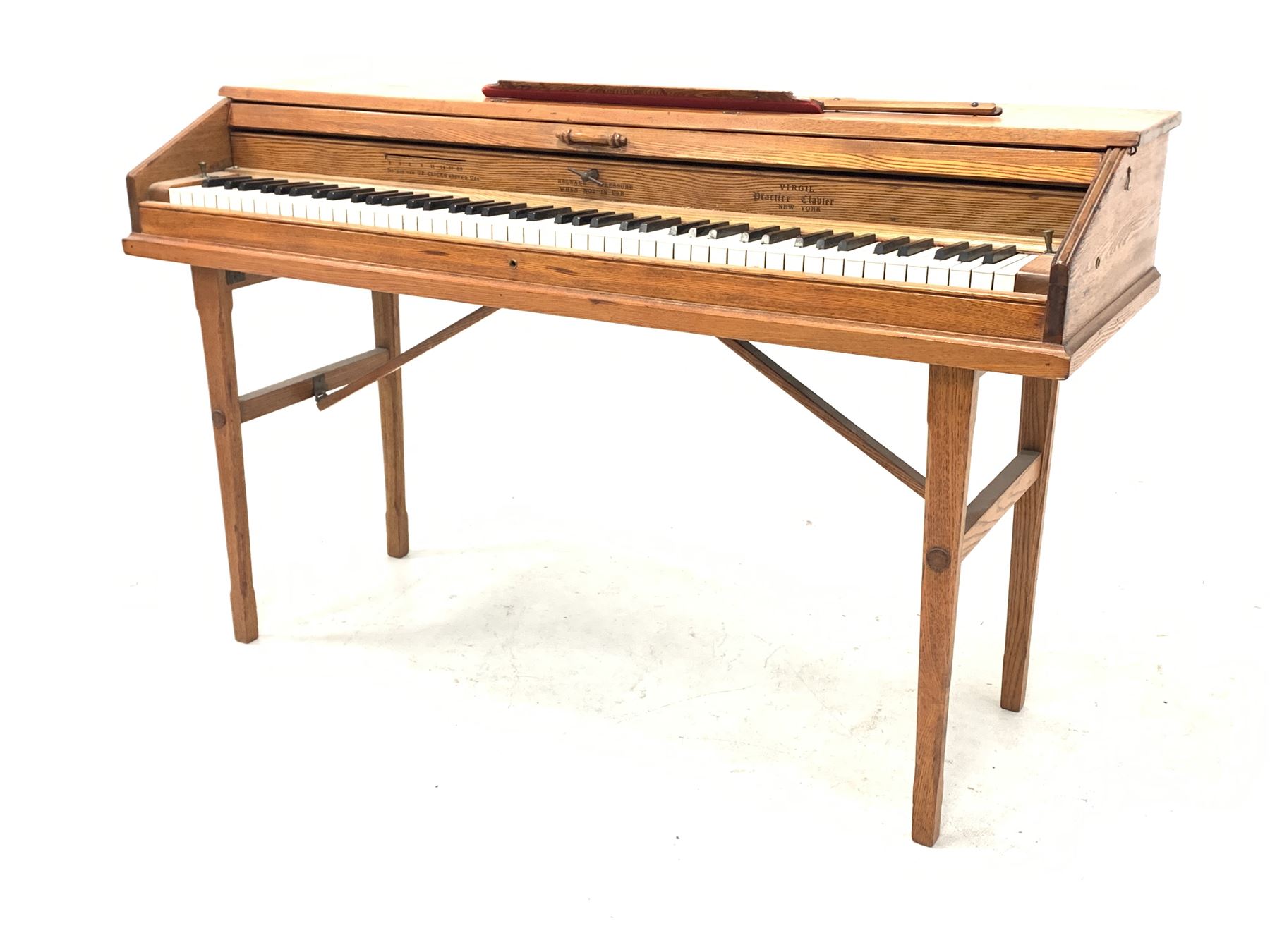 'Virgil Practice Clavier' - early 20th century dummy keyboard in oak case with folding trestle legs