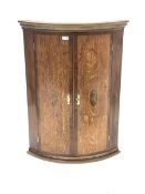 Early 20th century oak and mahogany banded bow front corner cupboard