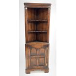 20th century distressed oak corner cupboard in the manner of Titchmarsh and Goodwin