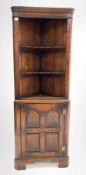 20th century distressed oak corner cupboard in the manner of Titchmarsh and Goodwin