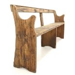 Early 20th century pine pew bench with shaped panel end supports W187cm