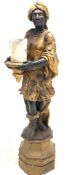 Late 20th century figural fibreglass uplighter in the form of a blackamoor holding a candle
