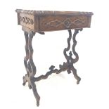 Victorian walnut sewing table the serpentine moulded top lifting to reveal fitted interior