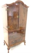 Early 20th century figured walnut dome top millinery cupboard