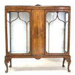 Early 20th century figured walnut display cabinet