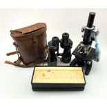 Pair of WW2 Bino Prism No. 5 binoculars in original tan leather case