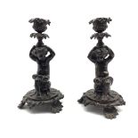 Pair of patinated bronze figural candlesticks