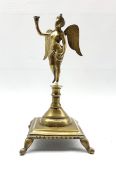 18th/19th Continental bronze candlestick in the form of a winged female figure on a square base and