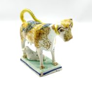 19th century Pratt type cow creamer with calf sponged in manganese and cobalt and on a rectangular p