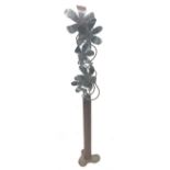 Large freestanding steel sculpture of a vase and flowers