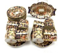 Eight Royal Crown Derby Duesbury coffee cans and saucers Patt.2451 and a matching oval dish