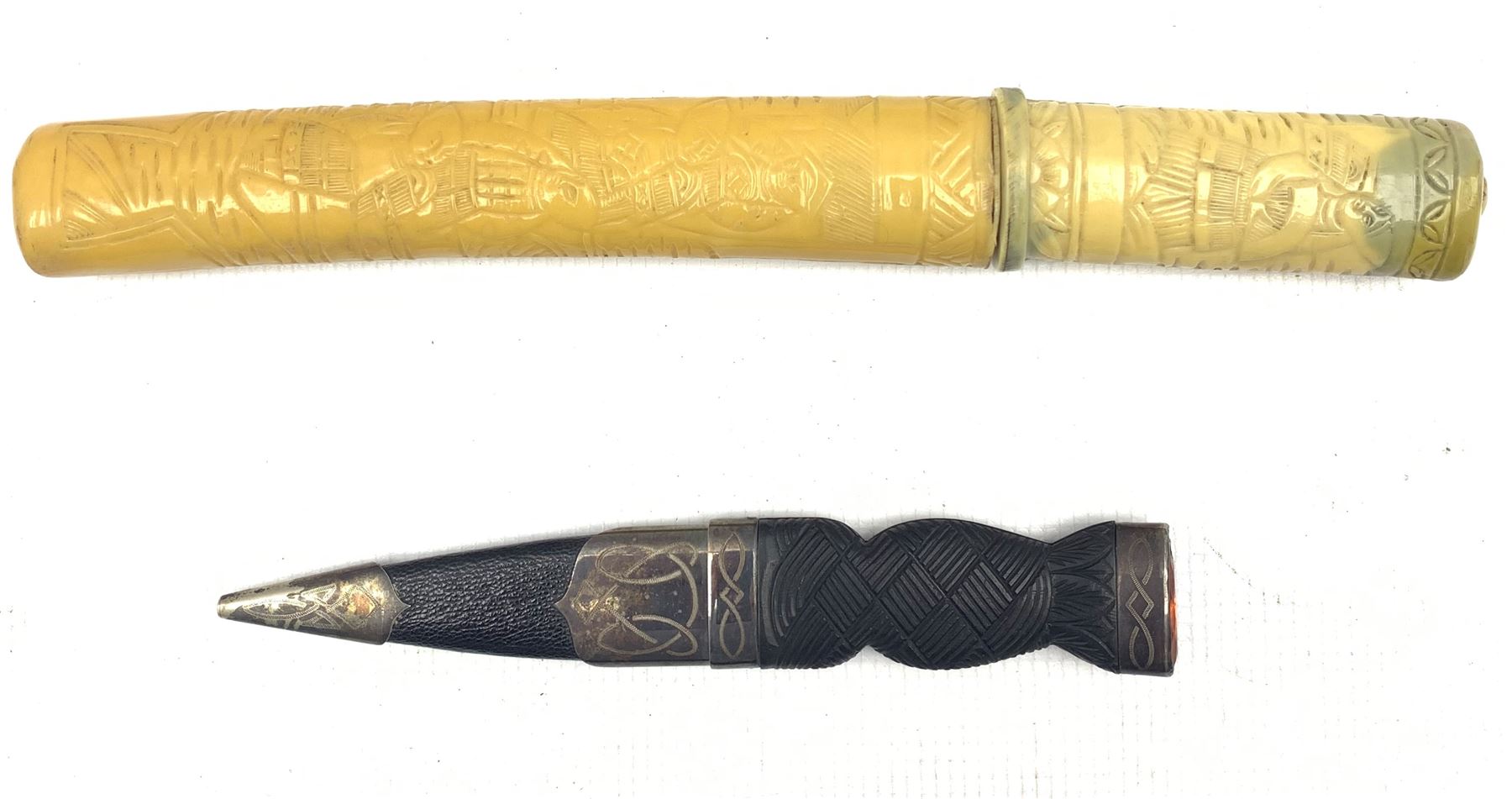 Scottish Sgian Dubh with silver-plated mounts and amber coloured inset terminal