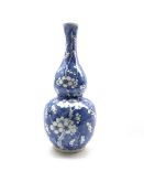 20th century Chinese gourd shape vase decorated with prunus in blue and white with four character ma