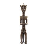 Fang carved hardwood ancestor figure formed as a standing male H66cm