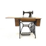 Early 20th century oak and cast iron Singer treadle sewing machine with four drawers