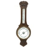 Edwardian carved oak aneroid wheel barometer and thermometer in banjo pattern case