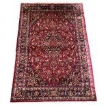Persian Meshed red and blue ground carpet