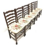 Near set of twelve late 19th century oak ladderback dining chairs with string seats and turned suppo