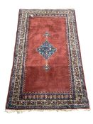 Persian Hamadan red ground rug with pole medallion