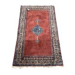 Persian Hamadan red ground rug with pole medallion