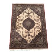 Persian design ground rug with floral medallion on beige field