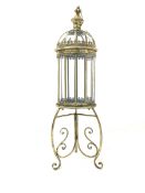 Gilt metal floor lantern with wrought scrolled supports H108cm