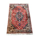 Persian design red ground rug