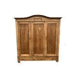 Late 19th century Continental pine triple wardrobe