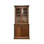 Edwardian oak bookcase on cupboard