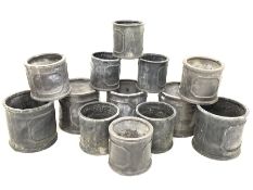 Thirteen cylindrical lead effect moulded poly garden planters