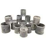 Thirteen cylindrical lead effect moulded poly garden planters