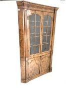 George II style figured walnut floor standing corner cabinet