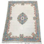 Large Indian type beige ground rug with floral decoration 368cm x 271cm