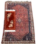 Hamadan rug of stylised floral design on a red field and bordered