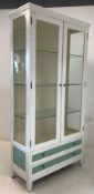 White painted glazed cabinet with two glass shelves and two drawers under W99cm