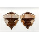 A pair of late Victorian mahogany wall brackets